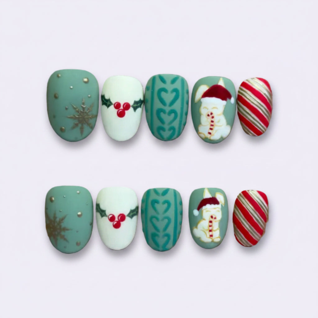 A set of 10 Christmas-themed press-on nails displayed on a brown cardboard backing against a light purple background. The designs include teal with gold glitter, white with red berries, teal with green hearts, a Santa Claus design, and red-and-white candy canes.
